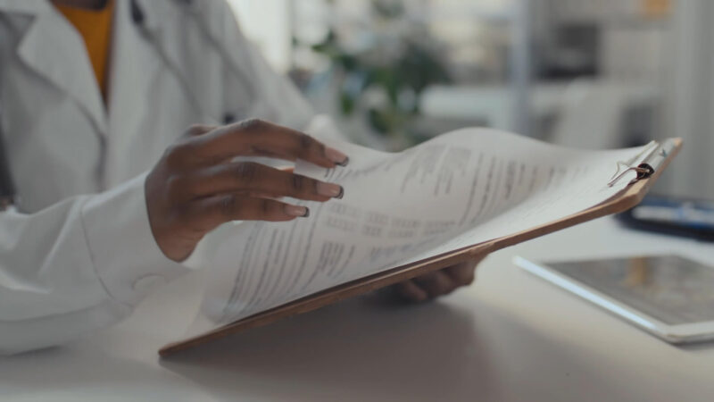 Doctor holding Medical History of the Patient