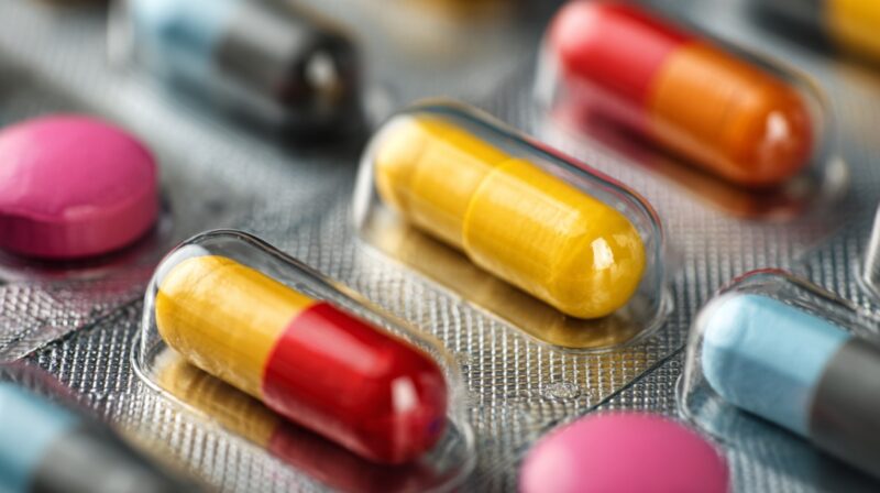 Close-up of colorful prescription pills and capsules in blister packaging